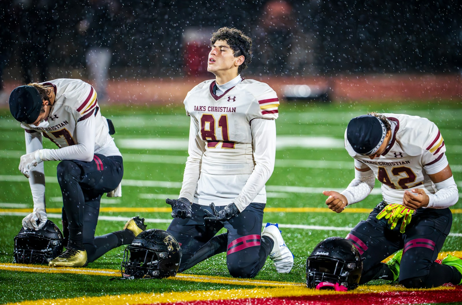 American football players training in rain representing washable team gear